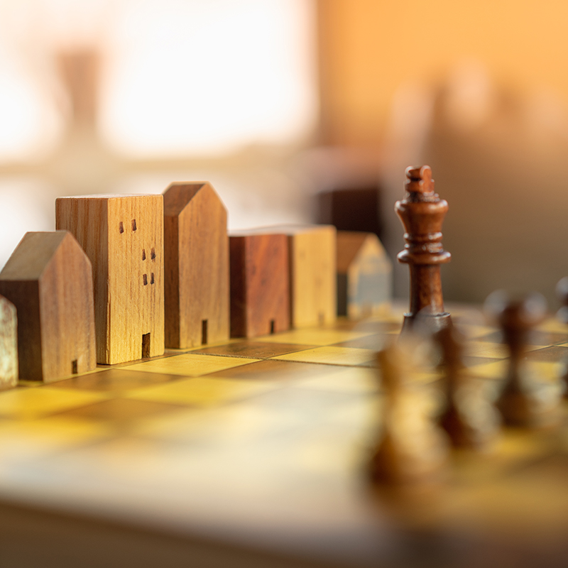 Building and house models in chess game, Business financial district and commercial , success and leadership business concep
