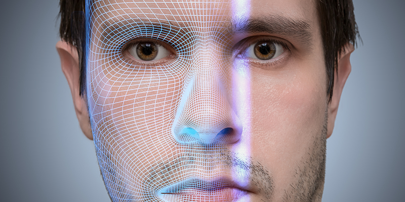 Biometric scanner is scanning face of young man. Artificial intelligence concept.